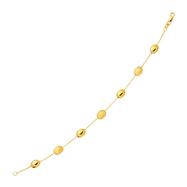 14k Yellow Gold Bracelet with Textured and Polished Pebble Stations
